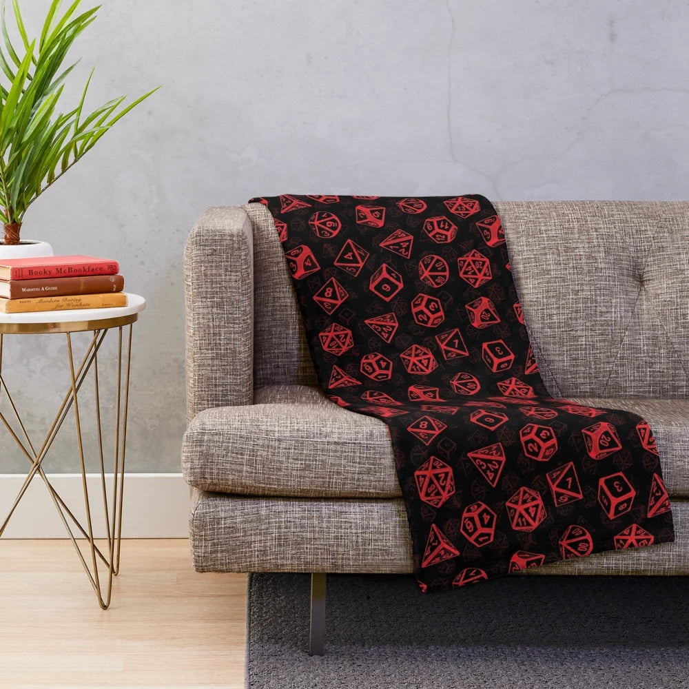 Soft, cozy plush blanket featuring a repeating pattern of d20 dice, perfect for Dungeons and Dragons and other tabletop role-playing game enthusiasts.