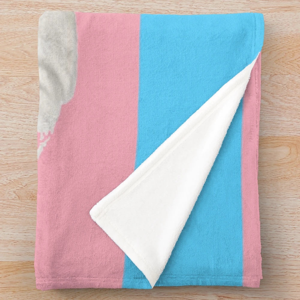 Cozy plush blanket featuring a trans pride design on a shark character
