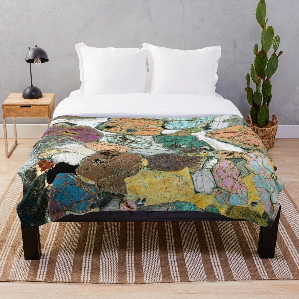Plush blanket featuring a microscope photo of peridotite rock from Scotland