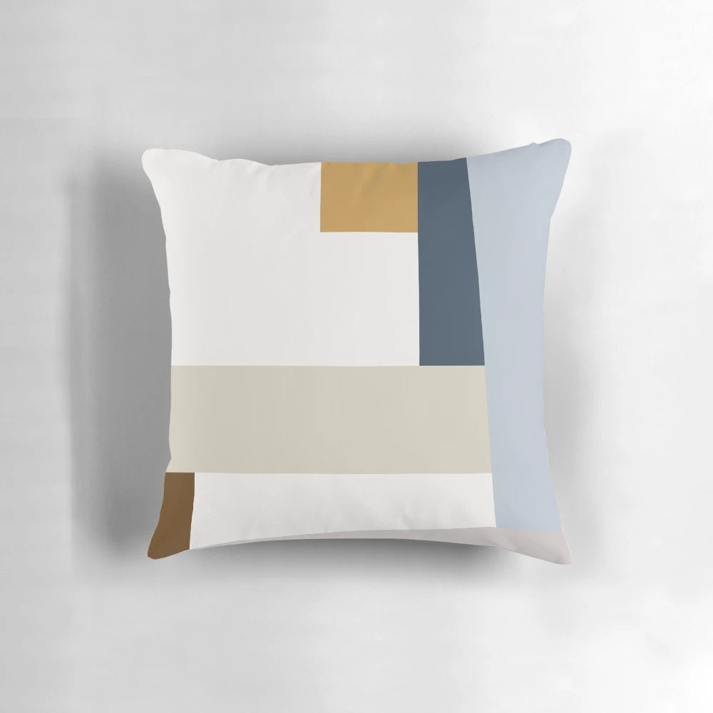 Colorful geometric abstract art print on a modern throw pillow, featuring a mid-century modern inspired design.