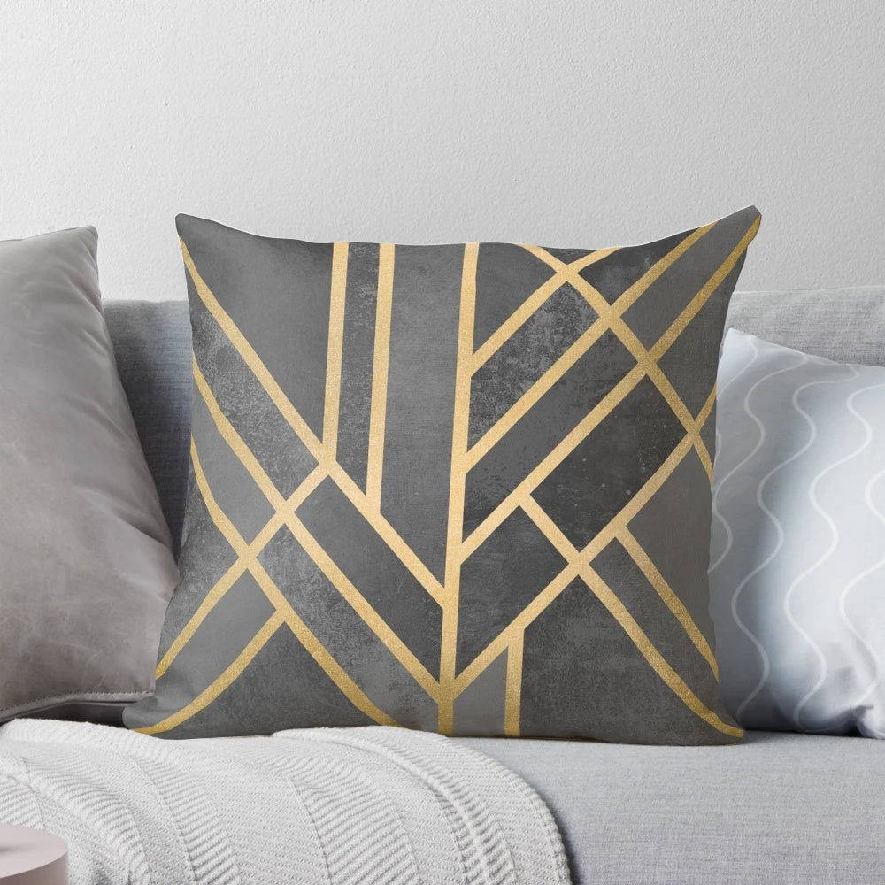Geometric abstract design throw pillow with grey, gold, and concrete elements
