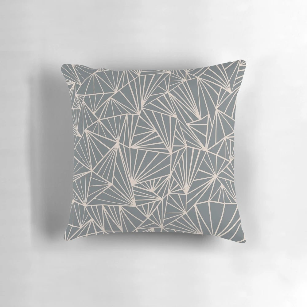 A stylish grey and nude geometric abstract decorative pillow for modern home decor