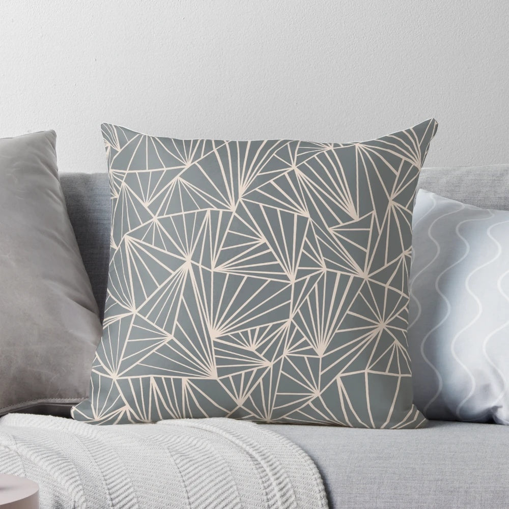 A stylish grey and nude geometric abstract decorative pillow for modern home decor