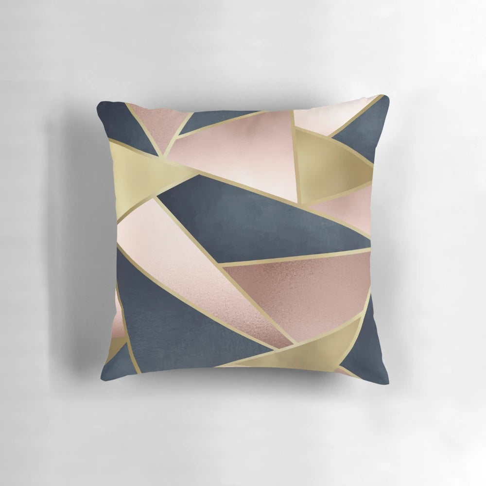 Geometric abstract pattern throw pillow in pink, gold, and navy blue