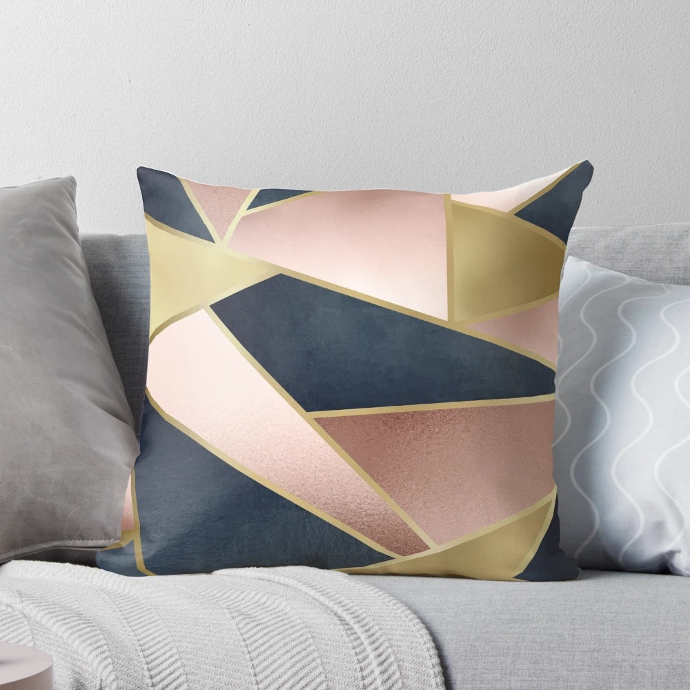 Geometric abstract pattern throw pillow in pink, gold, and navy blue