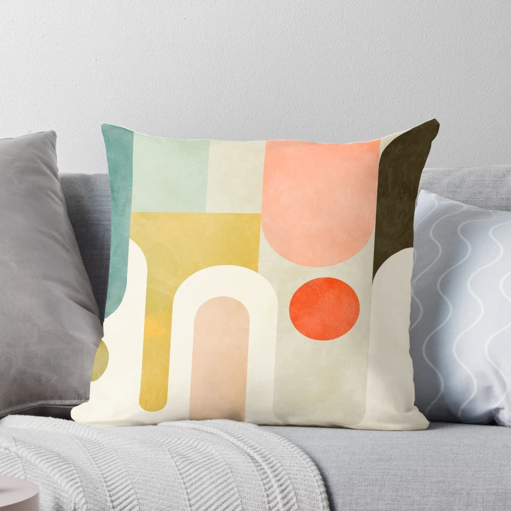 Geometric abstract design decorative throw pillow in bright pink, red, mint, and beige colors