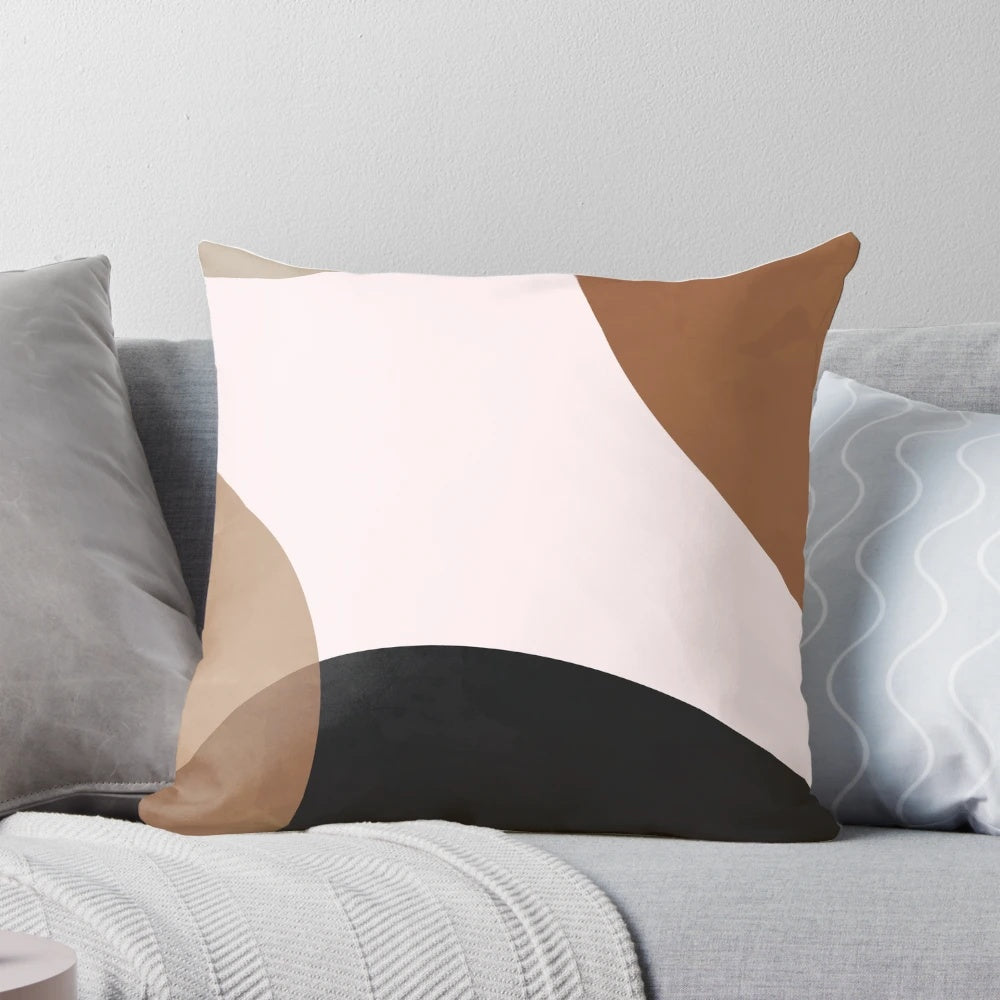 Abstract geometric shapes in neutral earth tones on a modern Scandinavian-style throw pillow
