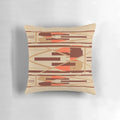 Geometric abstract design pillow in shades of tan, orange, and brown.