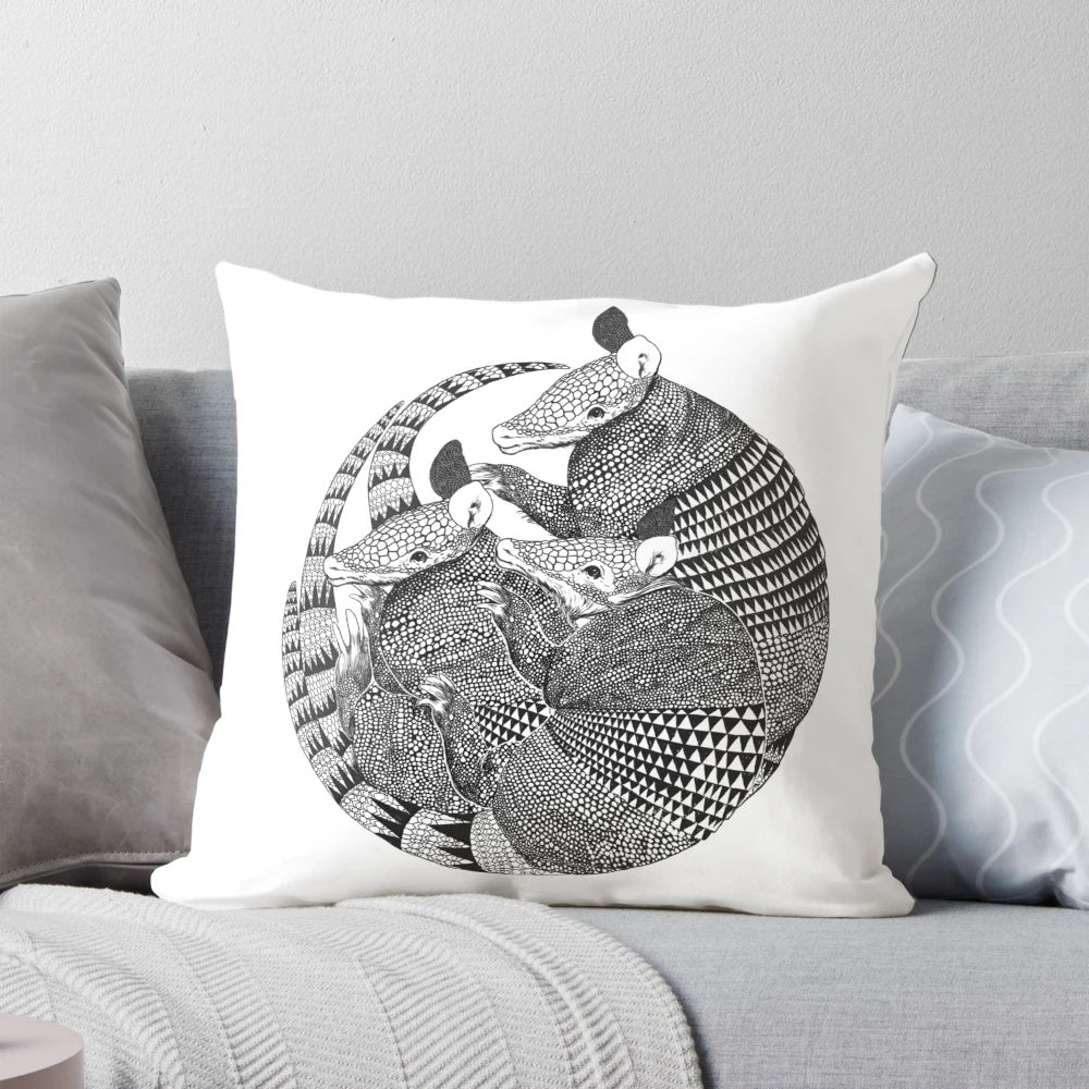 Decorative throw pillow featuring a geometric armadillo design in vibrant colors