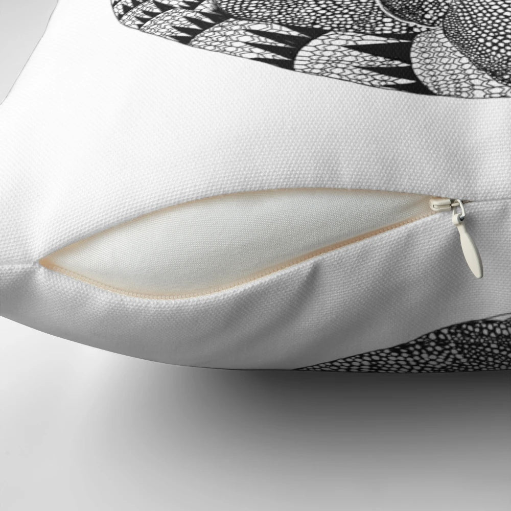 Decorative throw pillow featuring a geometric armadillo design in vibrant colors