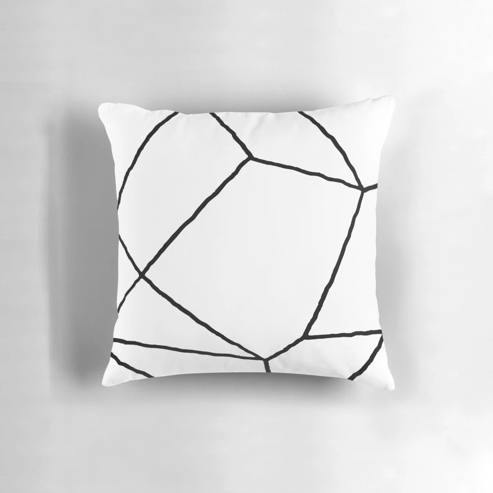 Geometric black and white throw pillow with a modern, minimalist design featuring mosaic lines and a square shape.
