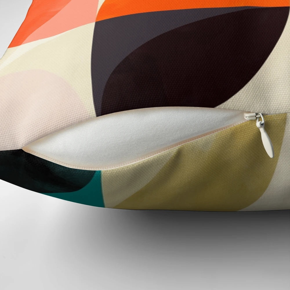 Set of four mid-century inspired throw pillows featuring geometric patterns in autumn colors.