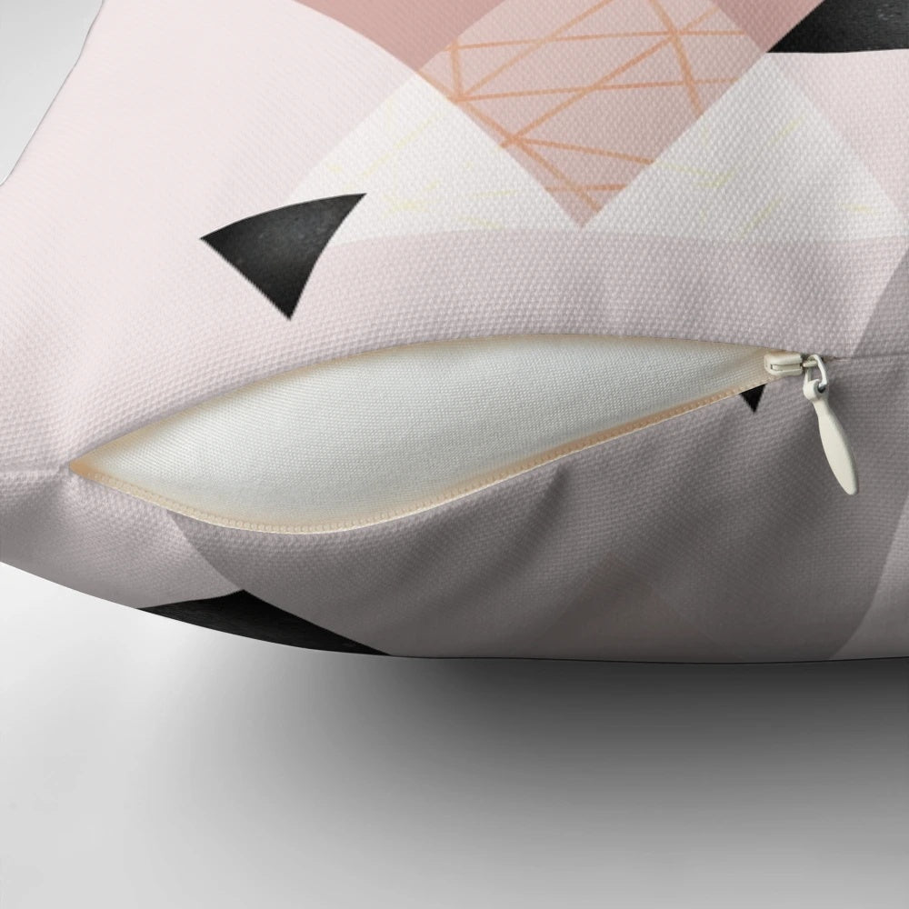 Stylish geometric throw pillow in blush pink and rose gold tones, perfect for modern Scandinavian-inspired home decor.