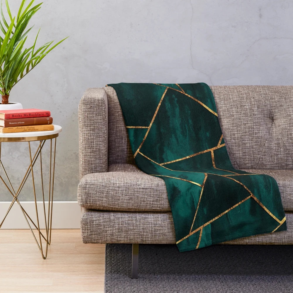 Geometric teal plush blanket with copper and gold accents