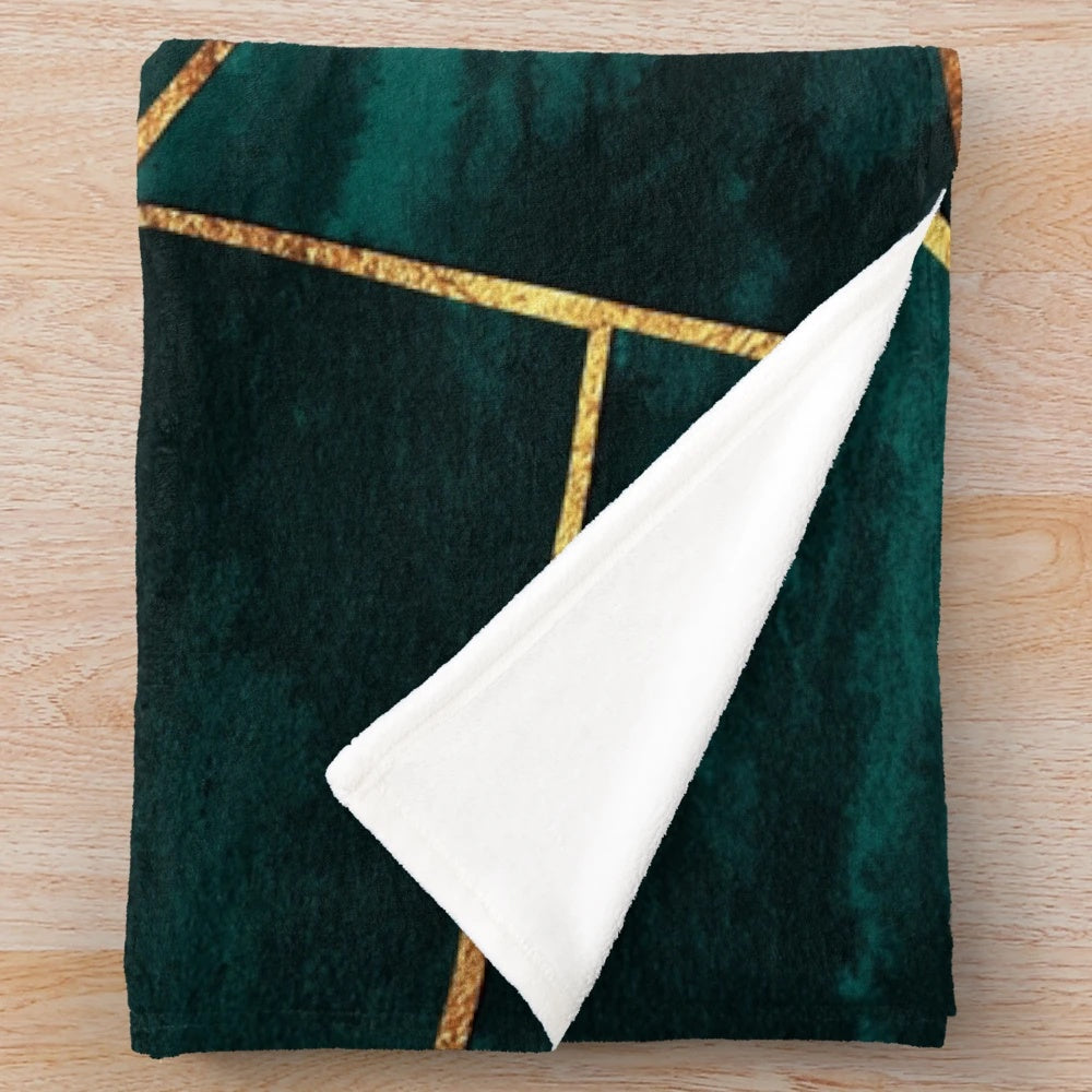Geometric teal plush blanket with copper and gold accents