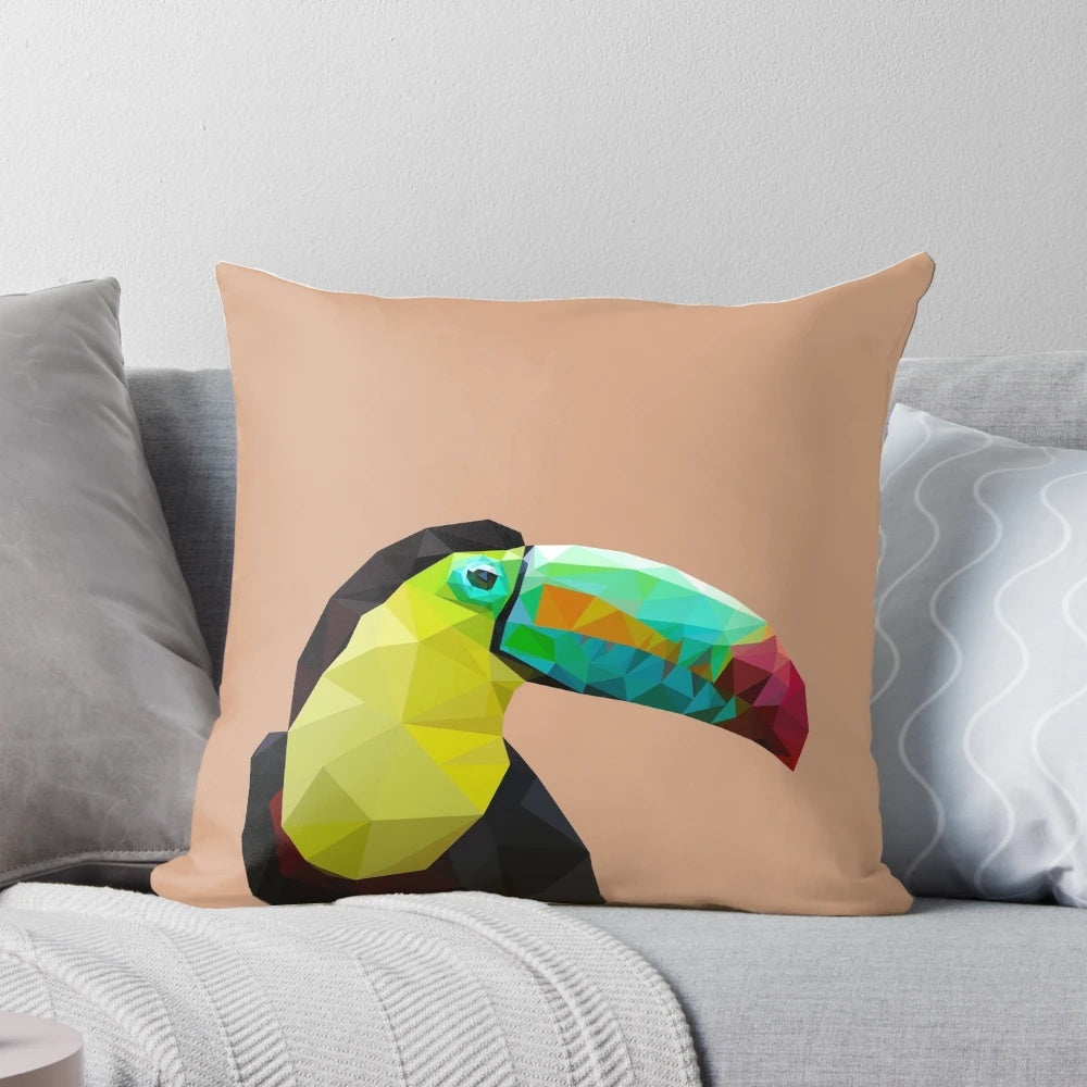 Decorative throw pillow featuring a geometric toucan design in shades of blue, yellow, and black.