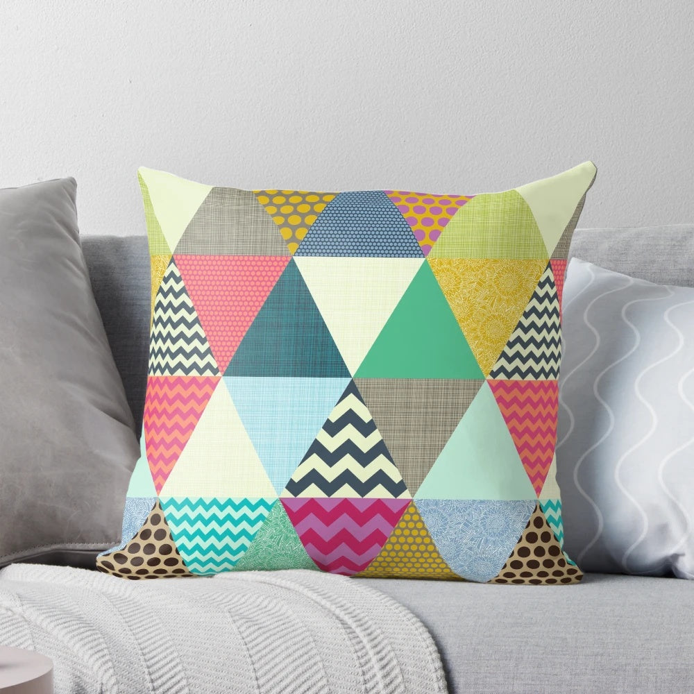 Vibrant geometric triangle patterned pillow with a modern floral design