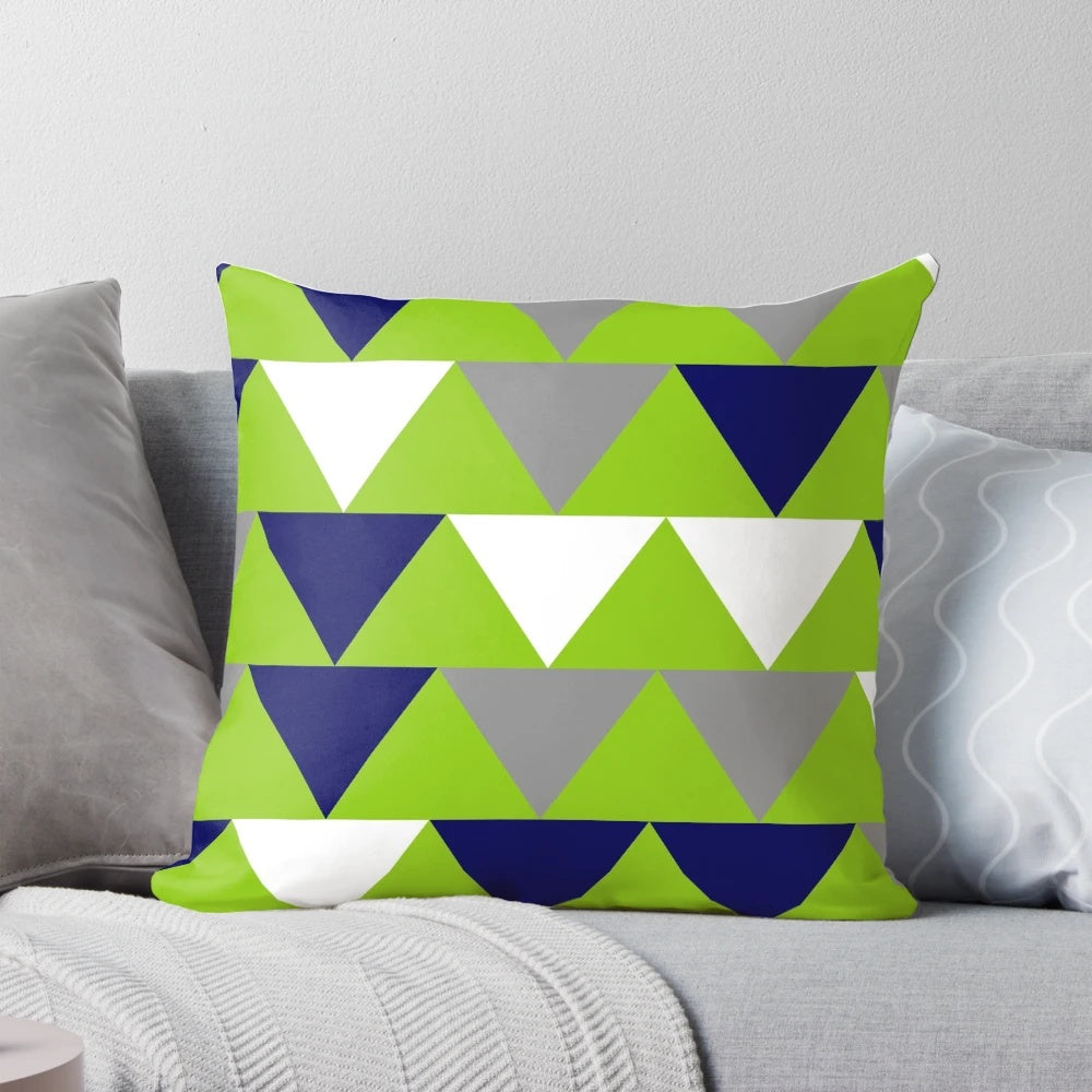 Geometric triangles patterned pillow in navy blue, lime green, and grey colors