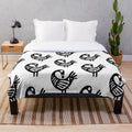 Ghanaian adinkra symbol 'Sankofa' printed on a soft, plush blanket