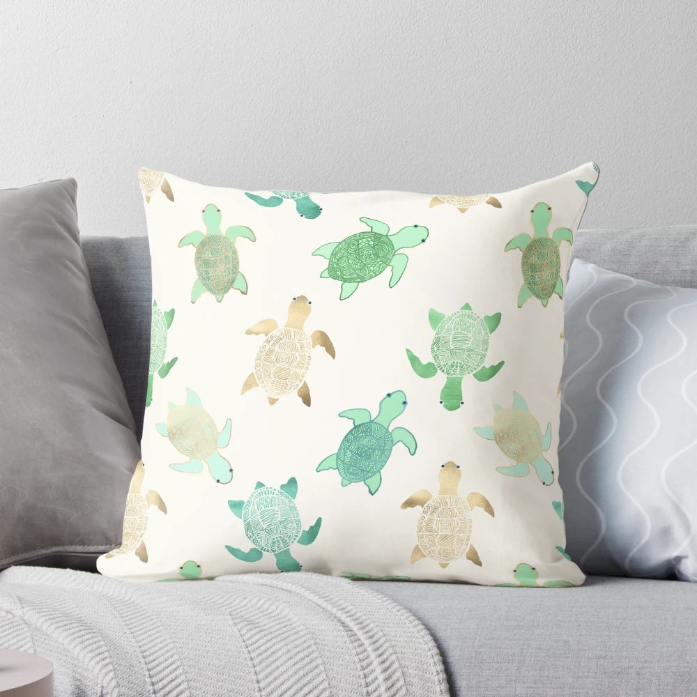 Decorative throw pillow featuring gilded jade and mint turtles, perfect for coastal home decor