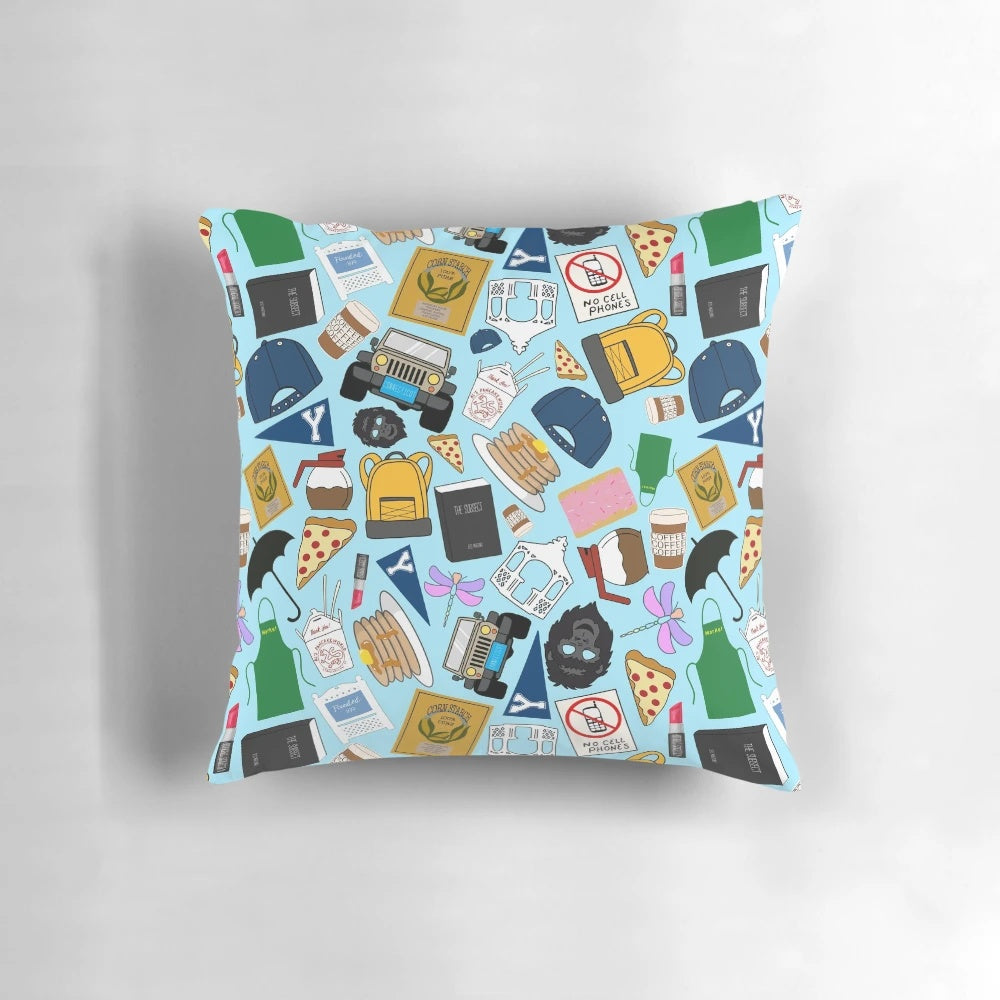 Blue pillow with all-over Gilmore pattern icons, perfect for fans