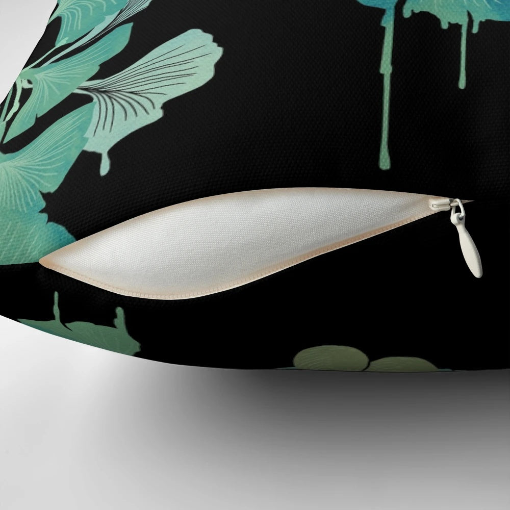 Artistic watercolor painting of ginkgo leaves on a black background, printed on a decorative throw pillow.