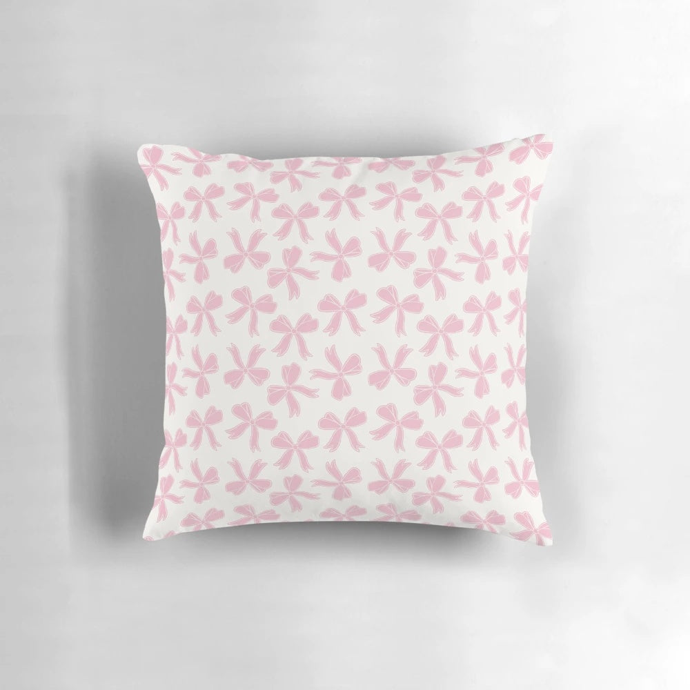 Cute pink bow decorative pillow with coquette aesthetic and hearts
