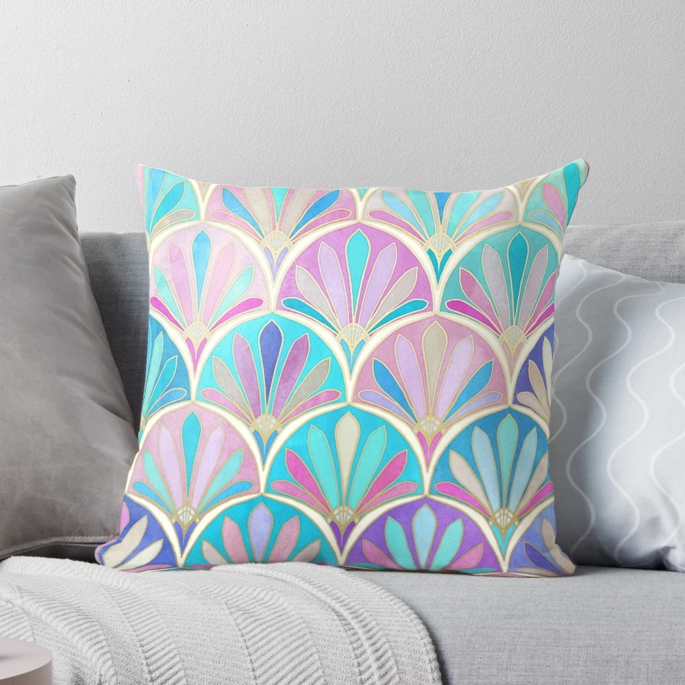 Decorative pillow with an art deco-inspired pastel pattern featuring mermaid scales and fish.