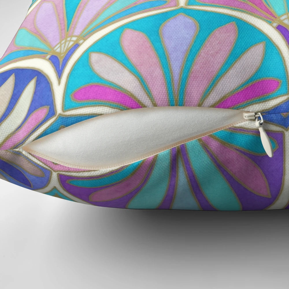 Decorative pillow with an art deco-inspired pastel pattern featuring mermaid scales and fish.