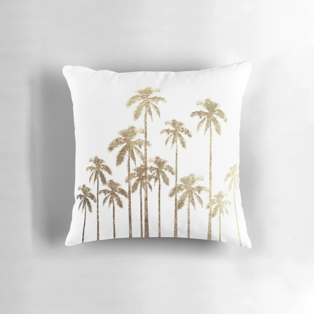 Glamorous gold tropical palm trees printed on a white decorative throw pillow