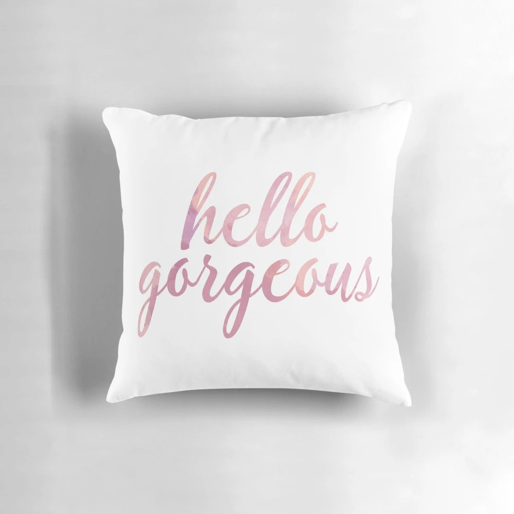 Soft, pink watercolor 'Hello Gorgeous' decorative pillow with a fashionable, chic design.