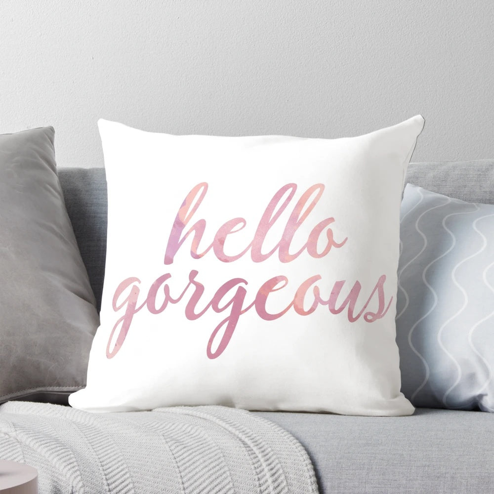Soft, pink watercolor 'Hello Gorgeous' decorative pillow with a fashionable, chic design.