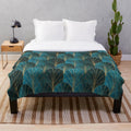 Teal plush blanket with textured art deco waterfall pattern