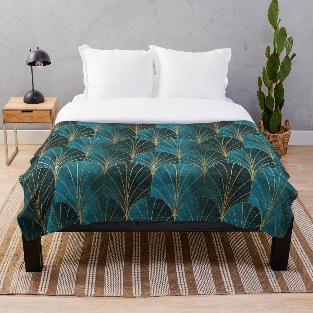 Teal plush blanket with textured art deco waterfall pattern