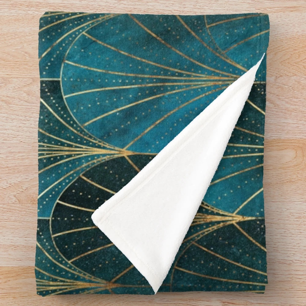 Teal plush blanket with textured art deco waterfall pattern