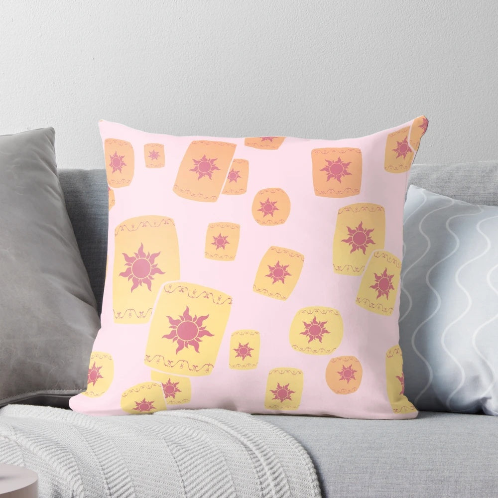 Vibrant, floating sun lanterns in a Disney Tangled-inspired design on a decorative pillow.