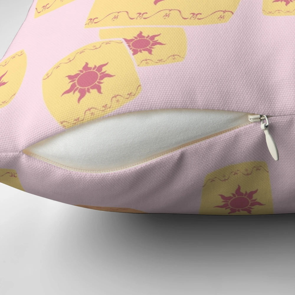 Vibrant, floating sun lanterns in a Disney Tangled-inspired design on a decorative pillow.