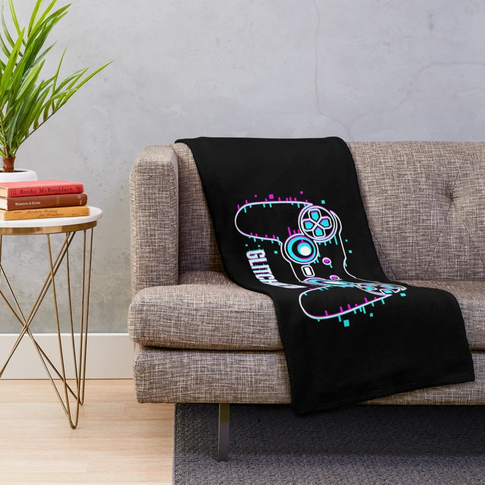 Glitched video game controller plush blanket with retro gaming design