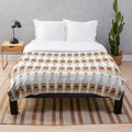 Glittering plush blanket with Tito's vodka inspired design