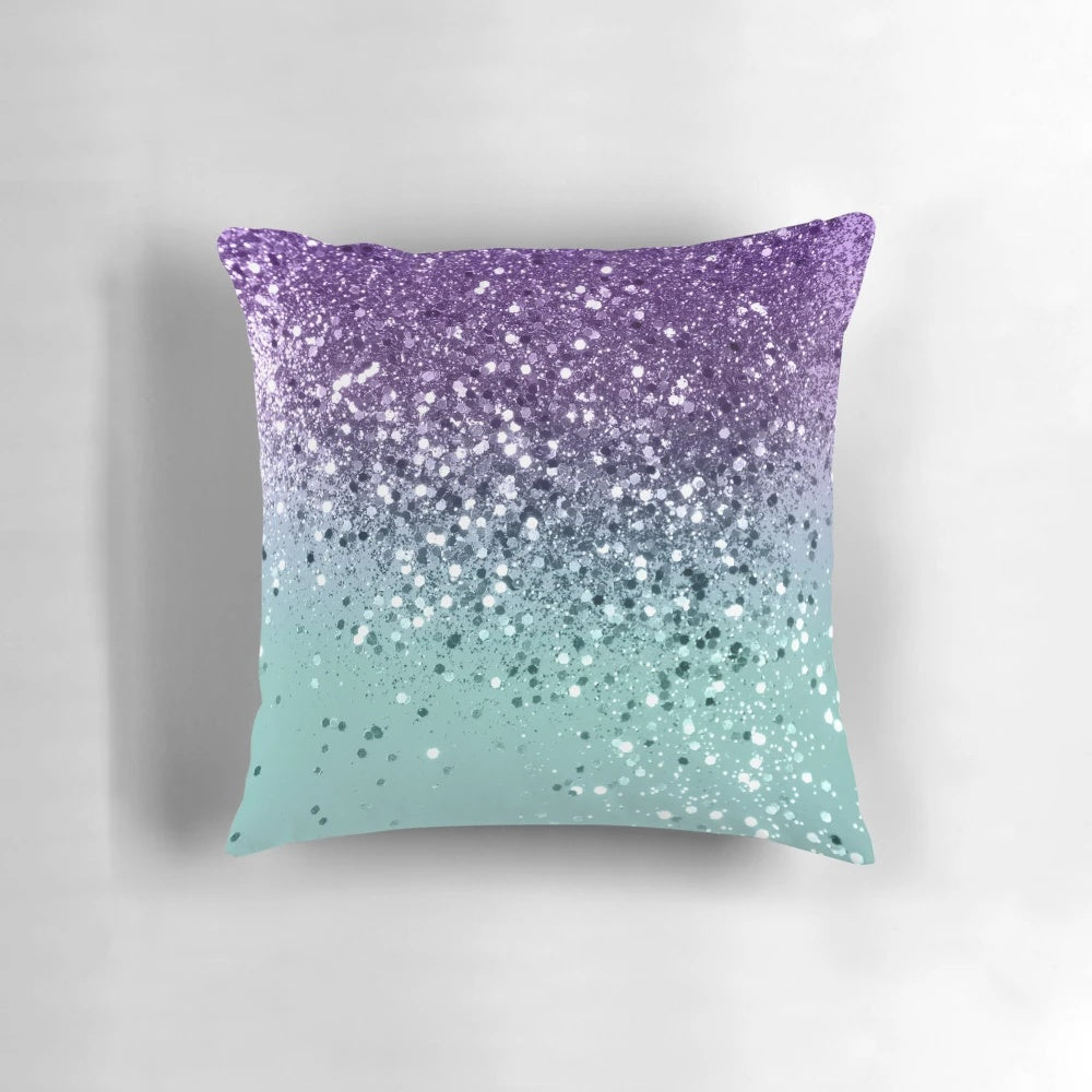 A vibrant and glittery mermaid-inspired pillow in shades of purple and teal, capturing the beauty of the ocean.