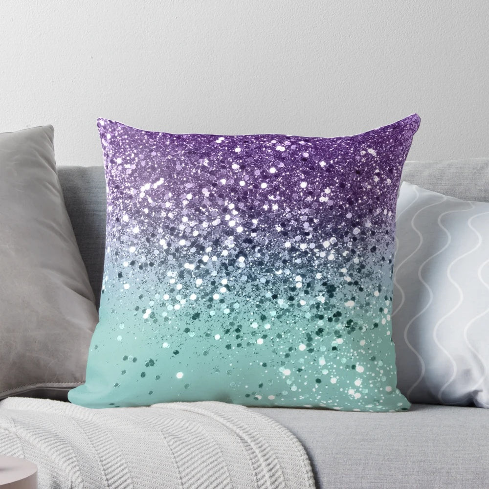 A vibrant and glittery mermaid-inspired pillow in shades of purple and teal, capturing the beauty of the ocean.