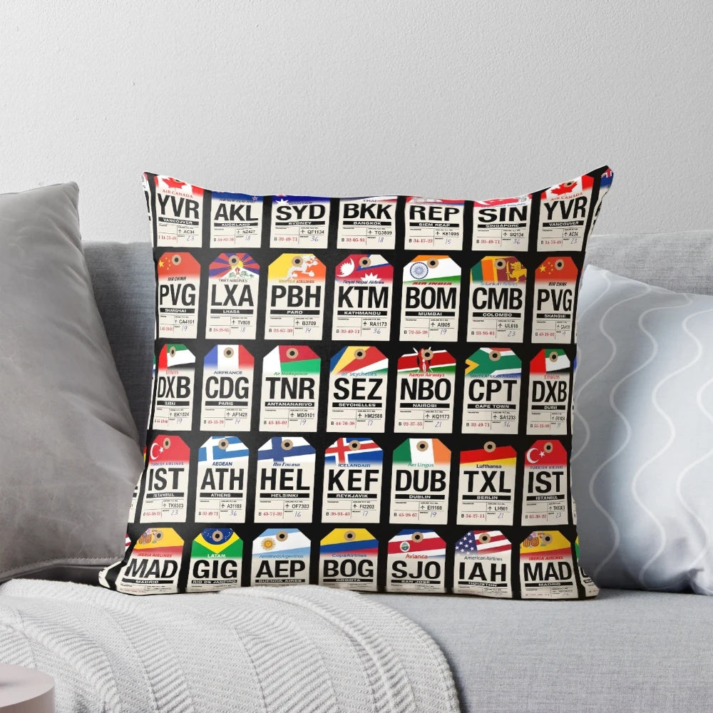 Airline luggage tag-inspired mosaic pillow with flags and IATA codes for worldwide destinations