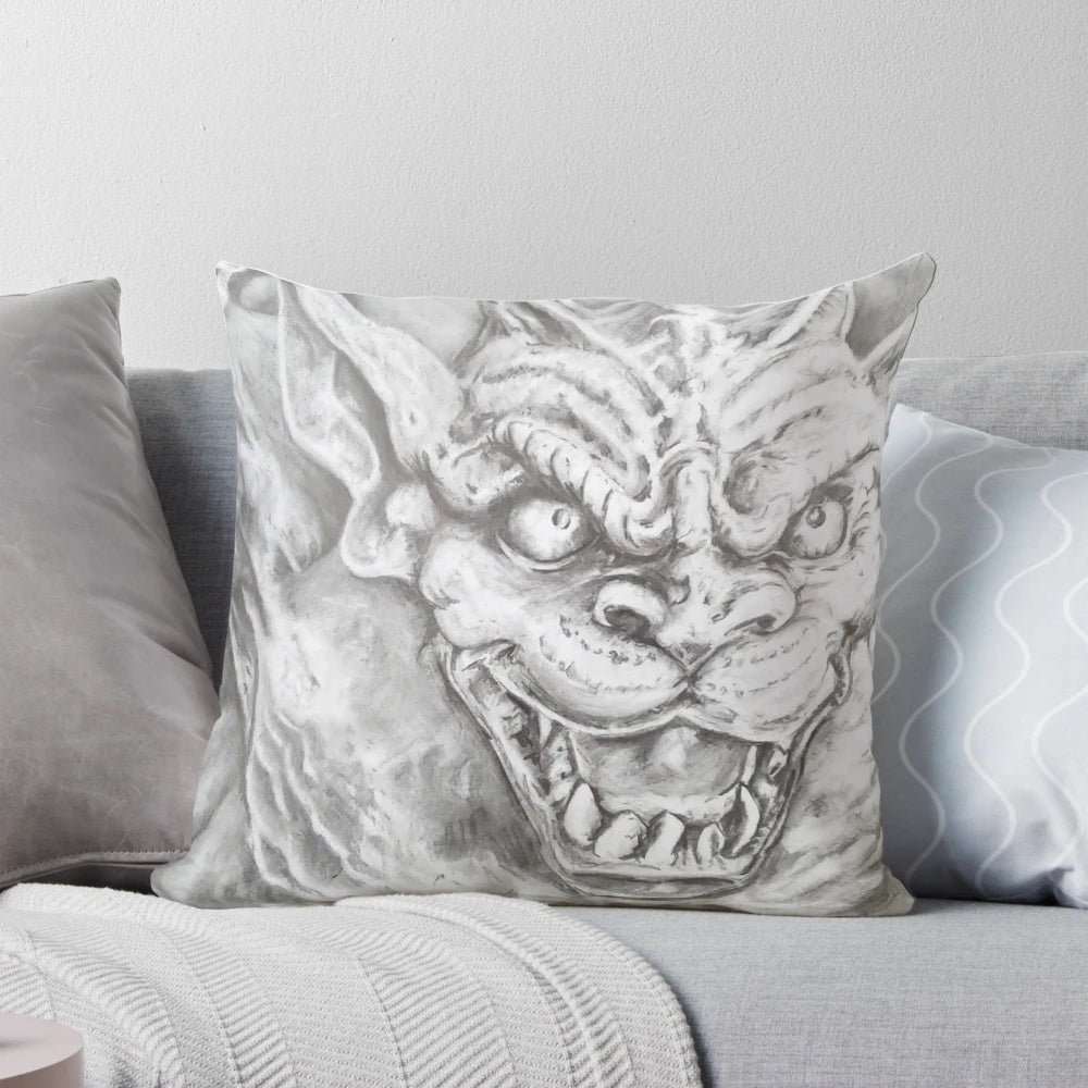 A cozy decorative pillow featuring a realistic sketch-style gargoyle design in shades of grey and black.
