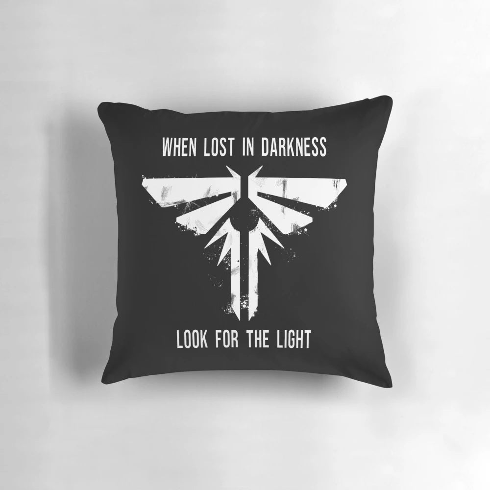 A Pillow Featuring Glowing Fireflies, a Symbol of Hope in the 'The Last of Us' Apocalyptic Gaming Universe