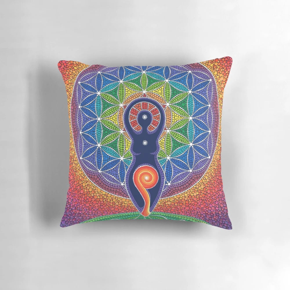 Vibrant pillow featuring a goddess figure in a beautiful rainbow and sacred geometry design, created by female artist Elspeth McLean.