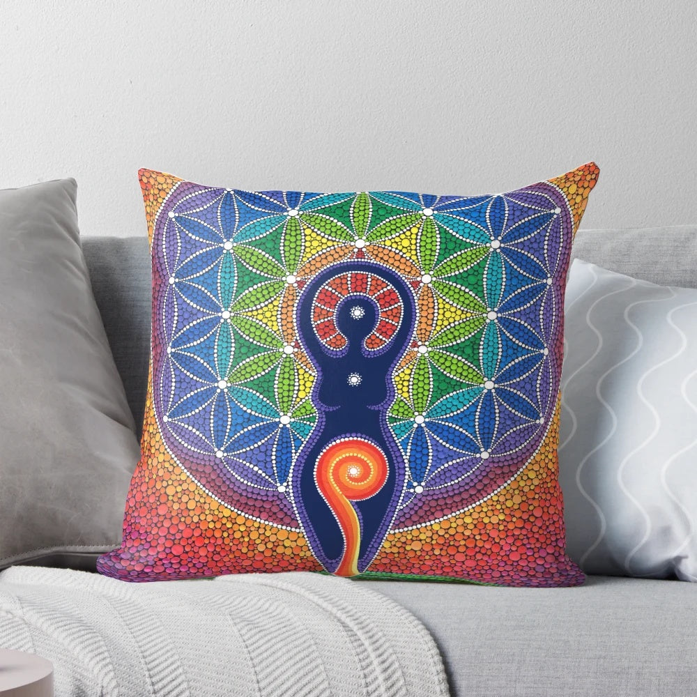 Vibrant pillow featuring a goddess figure in a beautiful rainbow and sacred geometry design, created by female artist Elspeth McLean.