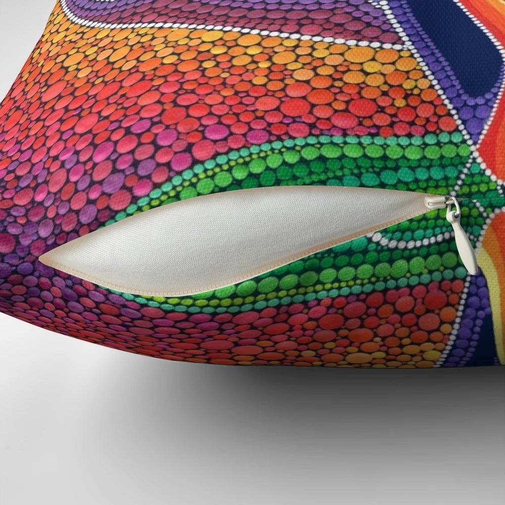 Vibrant pillow featuring a goddess figure in a beautiful rainbow and sacred geometry design, created by female artist Elspeth McLean.