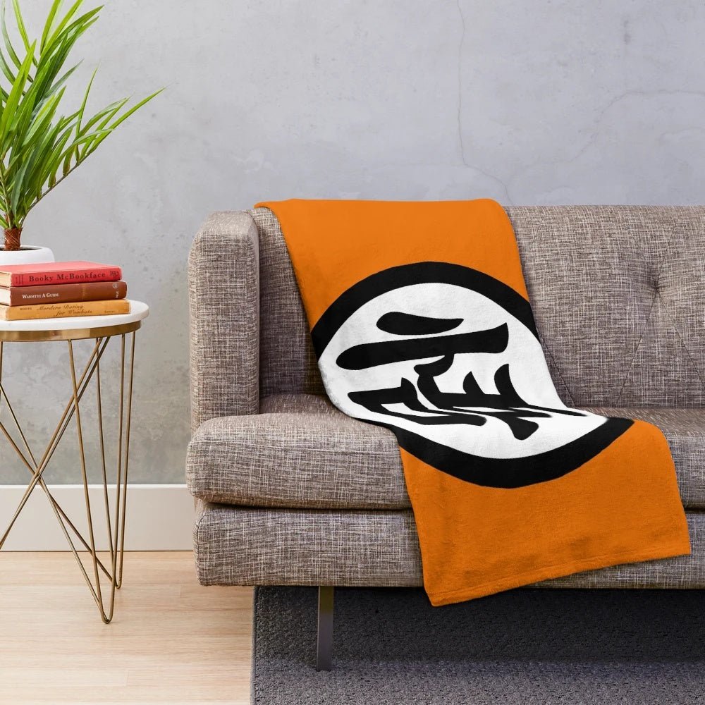 Goku's Dragon Ball inspired plush blanket with iconic saiyan symbol