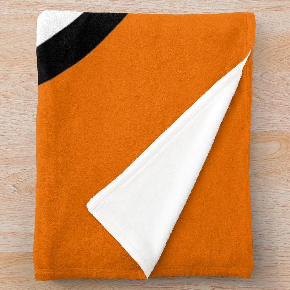 Goku's Dragon Ball inspired plush blanket with iconic saiyan symbol