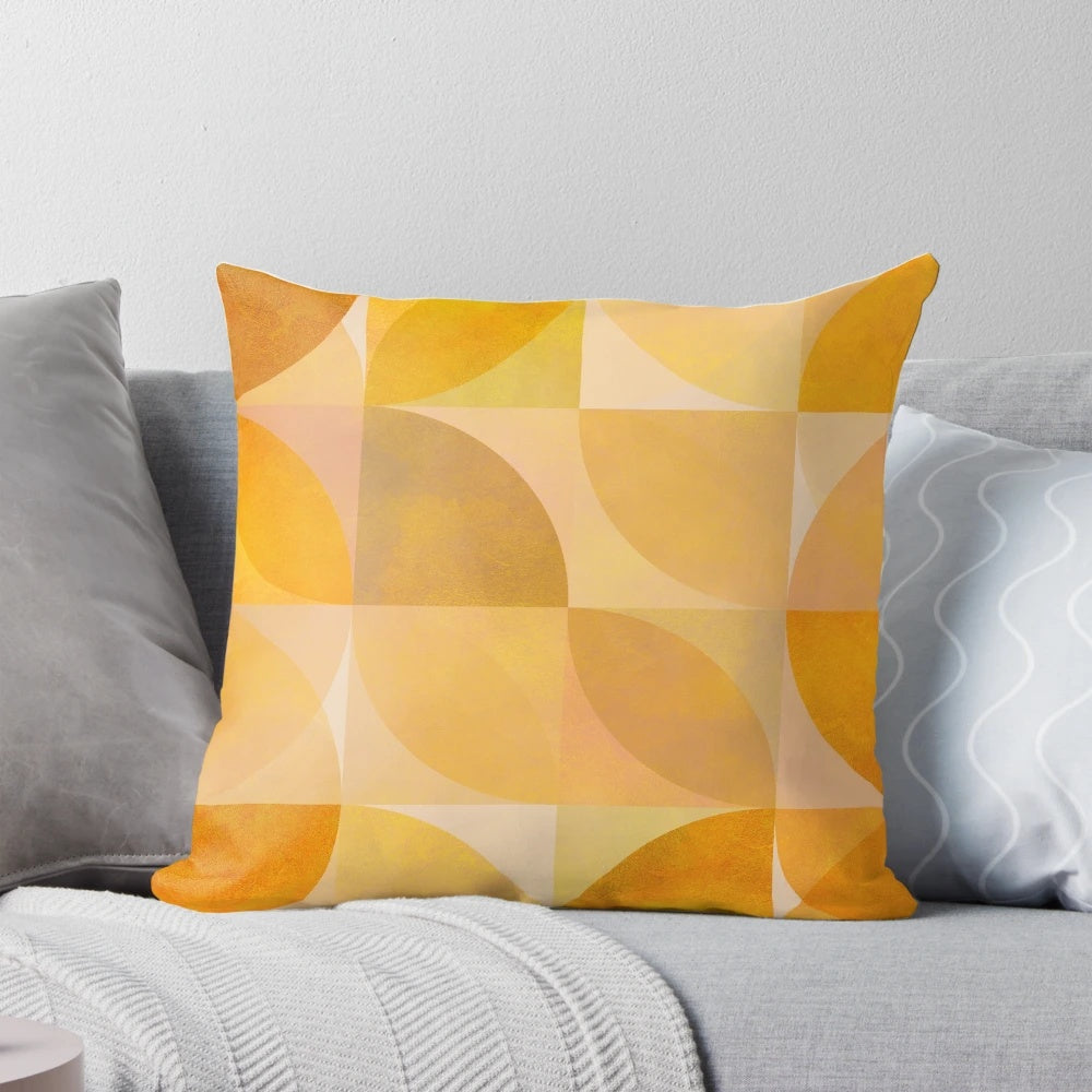 Golden mid-century modern geometric throw pillow with abstract circle and semicircle shapes